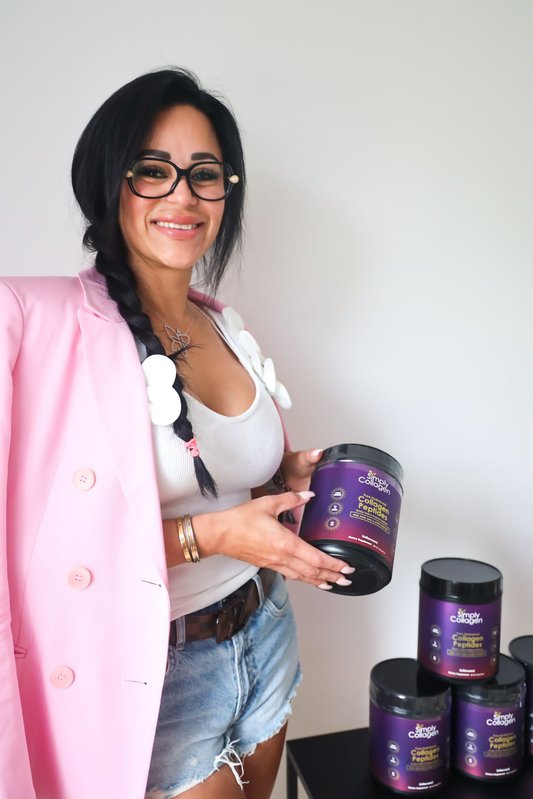 Woman Holding Collagen Supplements  