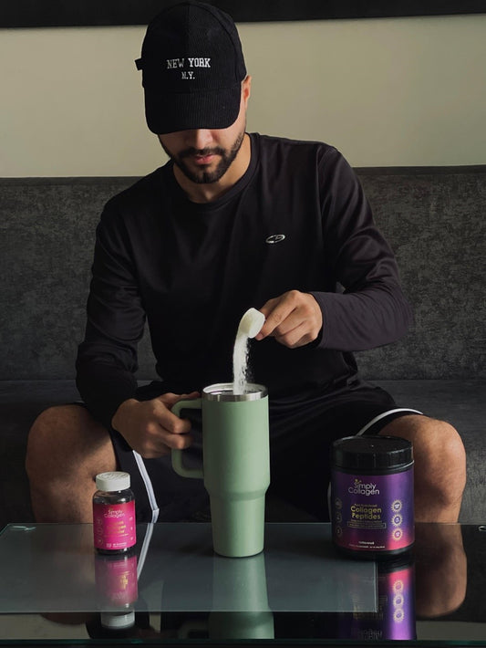 Man Putting Collagen Supplement In His Drink 