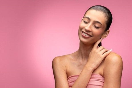 a woman touching her earlobe