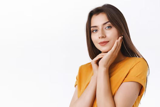 a woman with her hands on her face